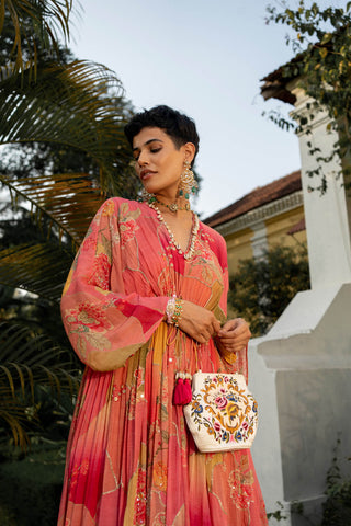 Model posing to give a closer look of the Kaftan embroidery, sleeves and design.