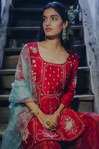 The Red Cherry silk gharara set is a perfect for a bride for a wedding chooda ceremony or welcome party.