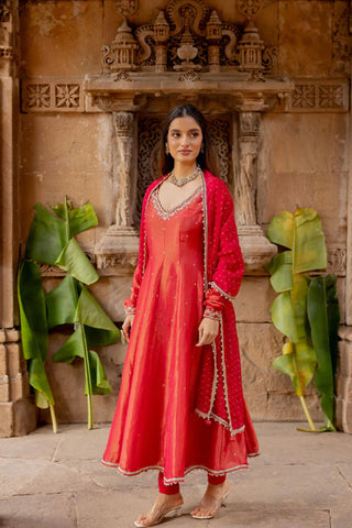 The side look of the cherry red tissue anarkali dress