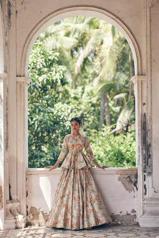 This chickoo peplum lehenga set with veil is a wedding attire for south asian brides.