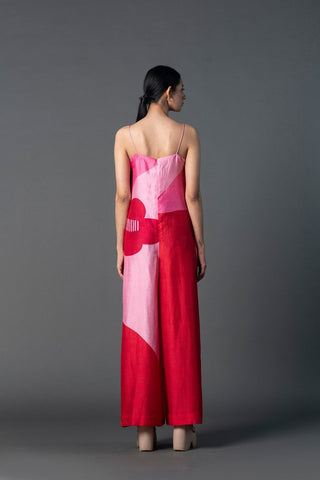 Back view of fuchsia sequin jumpsuit with sleek tailored fit for a glamorous look.