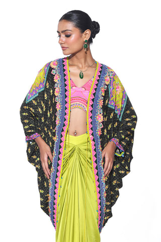 close up of the Dark Olive and pink Hand Embroidered Shrug, Pink Printed Sleeveless Blouse, Neon Green Drape Skirt. Crepe and satin gypsy dress and bohemian fashion for cocktail parties, festive gatherings, or resort wear.