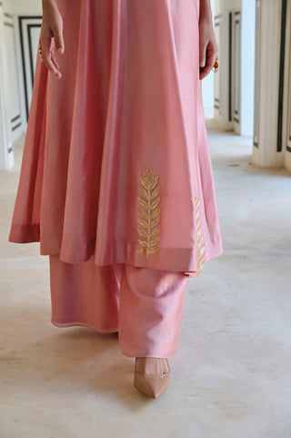 Close up of palazzo and Anakali dress with gold embroidery.