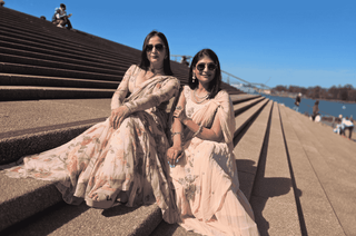 Leela Lane models in Paulmi and Harsh Predraped Prestitched Floral Chic Sarees Posing in front of Opera House Sydney. Posing for Festive-Forward Glam Photo Shoot Campaign for Leela Lane.  