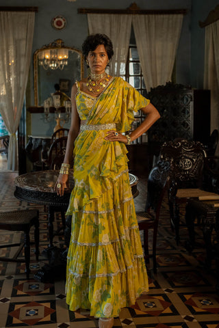 Featuring a lime yellow self–woven russian jacquard lehenga set paired with antique silver zari jaal embroidered blouse and pure tissue dupatta. Easy to wear pre-draped saree designed by Paulmi and Harsh