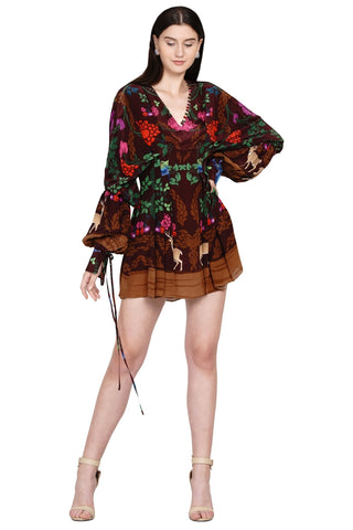 Designer printed dress with dramatic draped sleeves, V-neckline with loop detailing, and rich accent prints — a fusion of modern elegance and editorial flair. Designed by Limerick.