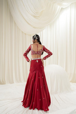 Model posing to show the back of the lehenga set