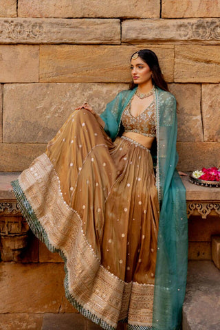 Model posing to give a look of the lehenga length and design