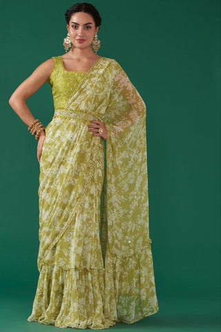 Featuring a moss green digitally floral jaal printed, pre-stitched draped saree paired with a matching hand embroidered blouse in silk base and a moss green hand embroidered silk detachable waist belt.