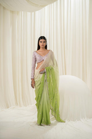 Featuring an Off white-parrot green ombre saree embroidered in sliver heavy jaal paired with a full sleeve blouse. A design by Ease