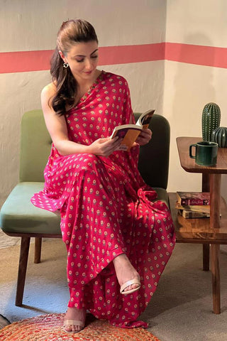 Soha Ali Khan showcases effortless elegance in Paulmi and Harsh beautiful butti printed one shoulder dress in rani pink, with small bell detailing on the neck and is paired with same print palazzos.