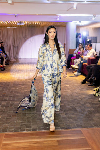 Designer presents a two-piece embroidered co-ord set. Indo Western Ivory base and blue print Peplum Outfit Set. Indian Designers at Australian Fashion Grandeur.