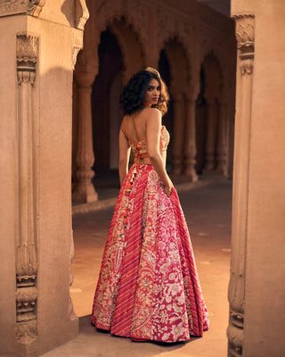 Side look of a pink multi-tone lehenga with side pockets in leheriya and floral prints the ancient craftsmanship of Rajasthan.