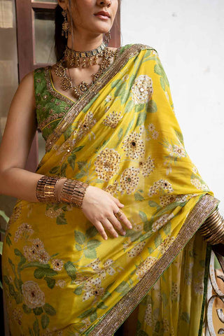 Indian saree set in lime yellow colour pure crepe fabric, in paulmi and harsh signature print which is heavily highlighted using mirrors and antique resham thread embroidery. A perfect women clothing for Indian or asian traditional ceremonies, Festivities, wedding, engagement, parties, pooja wear.