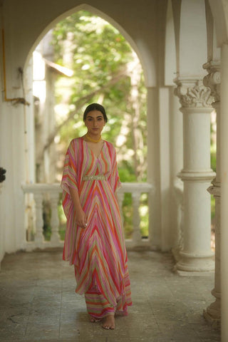 A multi–coloured striped set of an asymmetric kaftan and skirt paired with a square cut dana belt designed by Paulmi and Harsh.