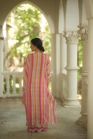 Back look of a multi–coloured striped set of an asymmetric kaftan and skirt paired with a square cut dana belt designed by Paulmi and Harsh.