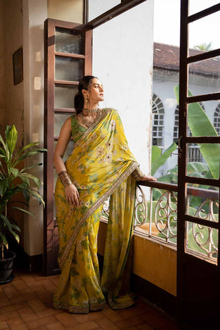 Indian saree set in lime yellow colour pure crepe fabric, in paulmi and harsh signature print which is heavily highlighted using mirrors and antique resham thread embroidery. A perfect women clothing for Indian or asian traditional ceremonies, Festivities, wedding, engagement, parties, pooja wear.