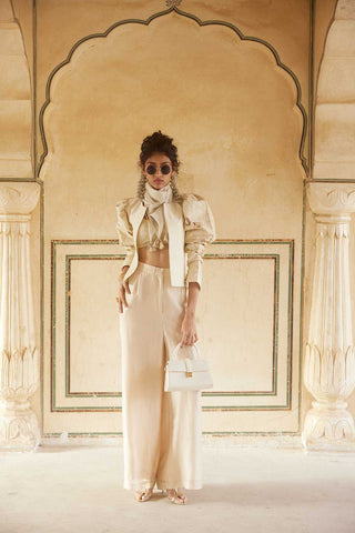 An outfit dress in ivory crop top and waist length jacket set W scarf designed by Paulmi and Harsh. A perfect look work and professional meetings or official parties.