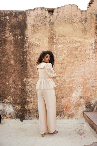 Back look of the ivory The peplum top and trouser with side pockets co-ord set.