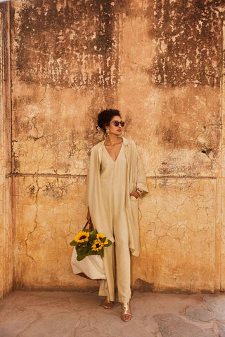 A Paulmi and Harsh jumpsuit cut from a soft linen fabric and jacket is cut from pure silk organza. The jumpsuit set has relaxed fit and is best paired with chic jacket.