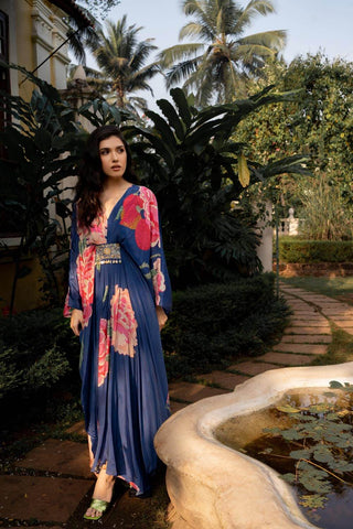 This Kaftan set is loved silhoutte in vibrant shades of blue, it is adorned with jewel - toned embroidery [sequins, cutdana, nakshi] , tassel trimmed using coins and cowrie shells.