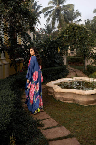 Pnh model is posing to show the back look of the kaftan set for vibrant floral placement print.