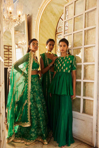 PnH models posing in traditional emerald green lehenga and suit sets