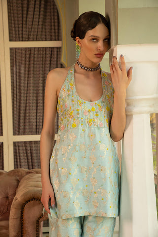 The close up look of the halter top woven in banarasi zari with Hand Embriodered Floral Lines.