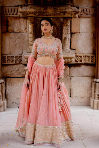 A perfect bridal wedding lehenga attire for any wedding occasion designed by Ivory by Dipika.