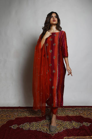 Featuring a straight Patchwork Kurta embroidered with intricately designed motifs. Paired with matching Narrow Pants and an embroidered Dupatta.