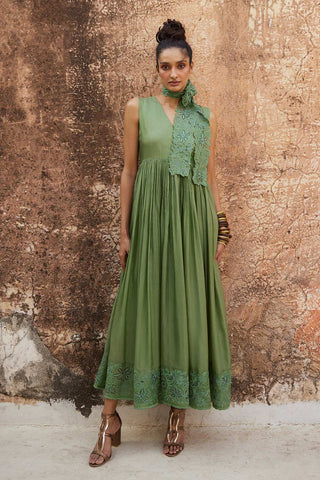 Paulmi and Harsh Indo-western chic sage green maxi dress is crafted in silk organza. It has a V neckline with lots of gathering details for an easy and flowy fit. It has an eye catchy cutwork technique details, it is paired with broad waist belt which you can style as a scarf. A perfect look for a beach wear, party, summer wear, dinner date, a dress to flaunt and style, an every day wear.