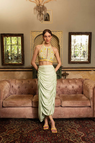 Embrace a unique blend of modern and traditional style with our captivating Striped Chanderi Bustier Set. This two-piece ensemble features a bustier crafted from luxurious striped chanderi fabric, exuding a contemporary elegance. The bustier cinches your waist for a flattering silhouette, creating a foundation for the exquisite top that steals the show.