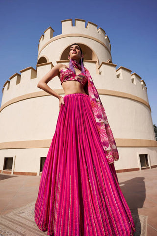 Fuschia and purple stripes lehenga, embroidered with nakshi line technique all over, paired with floral printed and embroidered blouse and floral printed organza dupatta with embroidery on the edge.