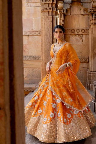 An Indian designer lehenga wedding attire available in 3 colours.